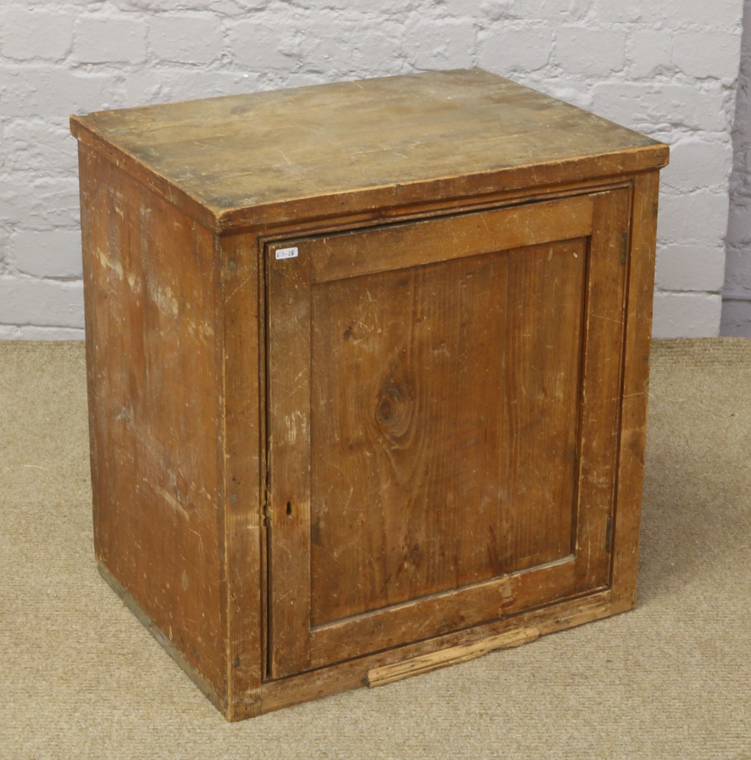 A small Victorian pine cupboard.