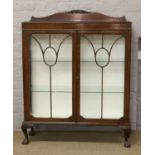 A 1930's mahogany astrigal glazed china cabinet on ball and claw feet. Condition report intended