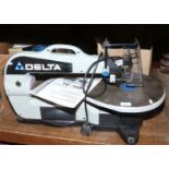 A Delta variable speed scroll saw with instruction manual.