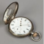 A Swiss silver half hunter pocket watch with white enamel dial, Roman numeral markers and subsidiary