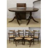 A mahogany twin pedestal dining table with extra leaf along with a set of four plus two carver arm