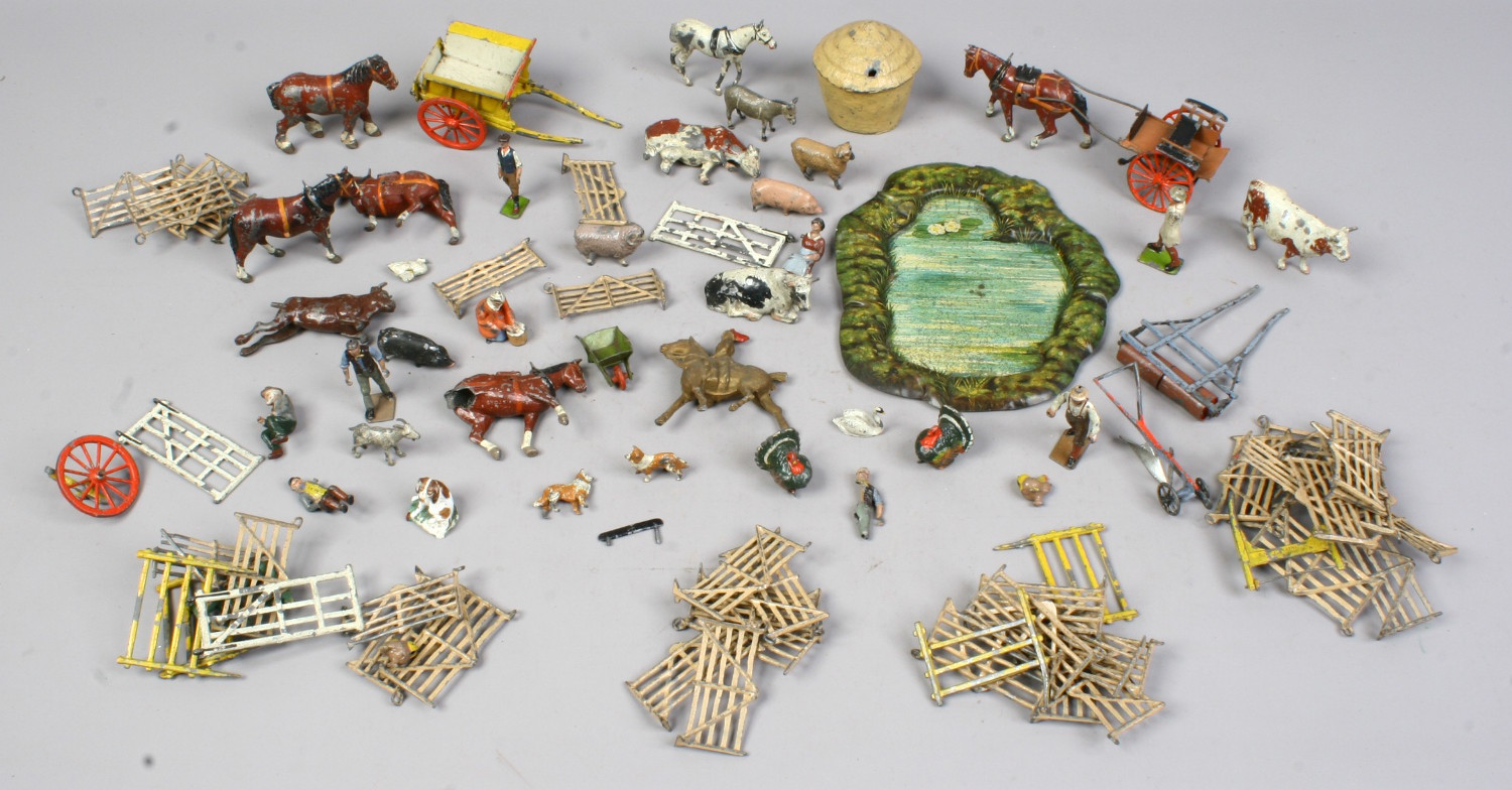 A box of children's spelter and lead farm toys, mostly by Britain's England with damage.