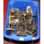 A box of clock movements and spare parts.