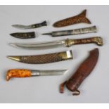 A group of knives to include antique eastern examples.