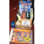 A box of children's toys and board games to include It's a Knock Out, Cludo. Space Pocket etc.