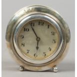 A silver cased desk clock, assayed Birmingham 1926. Condition report intended as a guide only. Dents