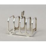 A silver five bar toast rack assayed Birmingham 1914, 61 grams.