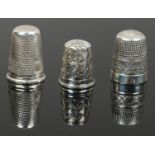 Three silver thimbles two hall marked.