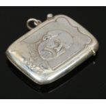 A reproduction sterling silver vesta case embossed with portraits of King George V.