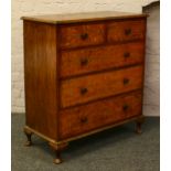 An oak chest of drawers.