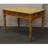 A Victorian pine farm house table with cutlery drawer.