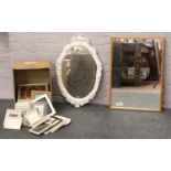 A box of picture frames along with two mirrors.