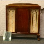 A 1940's mahogany bow front china cabinet with astrigal glazed doors.