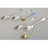 Six silver spoons including Danish gilt with enamel decoration and Georgian examples.