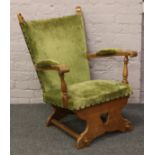 An upholstered oak arm chair.