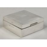 A silver mounted small cigarette box with engine turned engraving, assayed Birmingham 1961.