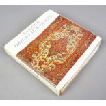 A hardback book Antique Oriental Carpets from the 17th to the early 20th century with maps and