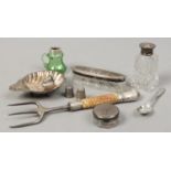 A mixed lot of mainly silver collectables including four thimbles, shell formed butter dish, assayed