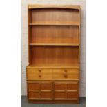 A retro 1970s teak open display wall unit incorporating drawer and panelled cupboard with