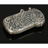 A reproduction sterling silver vesta case with embossed decoration.