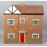 A scratch built dolls house and assorted furniture.