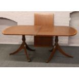 A mahogany twin pedestal dining table.