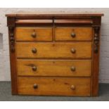 A Victorian oak and mahogany chest of drawers.