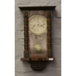 An early 20th century walnut cased musical wall clock.