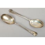 A pair of silver rat tail table spoons by Cooper Bros & Sons, assayed Sheffield 1938, 161 grams.