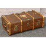 A wood bound canvas travel trunk, monogrammed E. J. M.