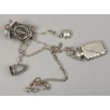 A silver plated Chatelaine and four appendages including three silver examples, one a scent bottle