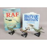 Three Diecast models of military aircraft on stands, along with two military aircraft related