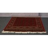 A red ground Bokhara rug, 2.3m x 1.62m.