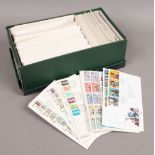 A box of British first day covers.