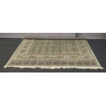 A large green ground Bokhara rug, 2.5m x 2m.