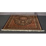 A blue ground Keshan rug with medallion design, 2.3m x 1.6m.