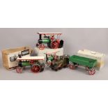 Two boxed Mamod steam tractors and a boxed Mamod open wagon.