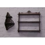 An oak three tier hanging open wall shelf with reeded mouldings, along with an open fretwork