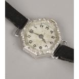 An Art Deco 18ct white gold ladies cocktail watch with wire lugs and diamond set bezel. Condition