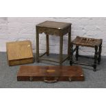 A group lot of occasional furniture to include leather top stool, desk top bureau, wooden gun case