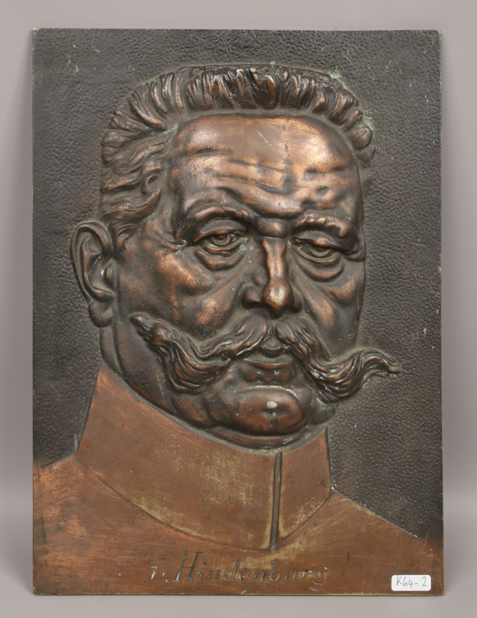 A bronze plaque entitled V. Hindenburg.