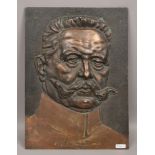 A bronze plaque entitled V. Hindenburg.