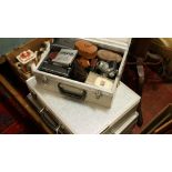 Three aluminium flight cases, one containing vintage photographic equipment, mainly light meters,