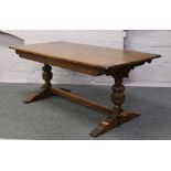 An Old Charm carved oak refectory table raised on bulbous supports.