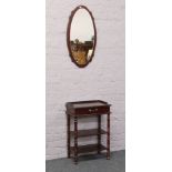 A mahogany effect telephone table and matching wall mirror.