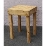 A pine butchers block on square cut legs.