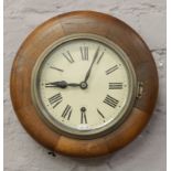 A mahogany cased station clock with white enamel dial and Roman numeral markers (with key).