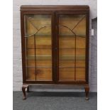 A mahogany astrigal glazed china cabinet.