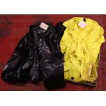 Two vintage British Rail full length water proof coats; one black the other yellow by Del Guerras of