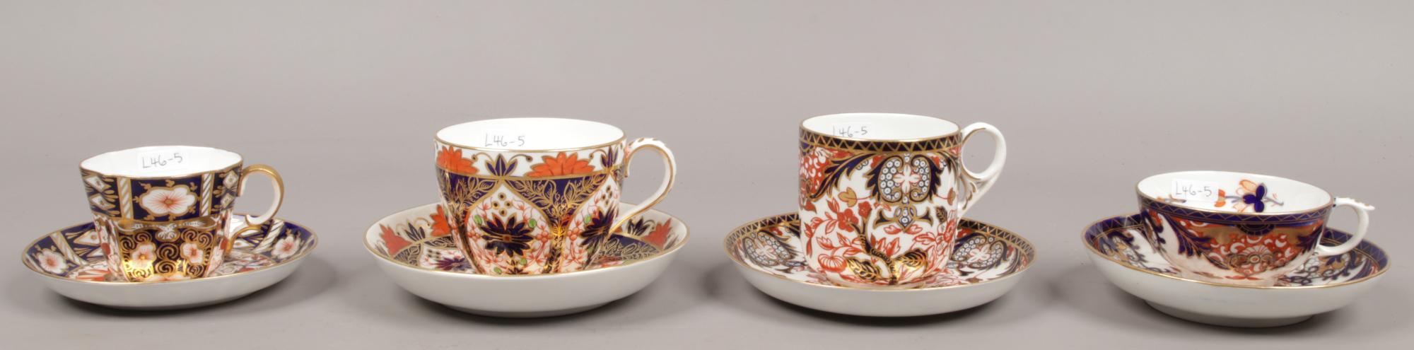 Four Royal Crown Derby cups and saucers all in the Imari design including a moustache example.